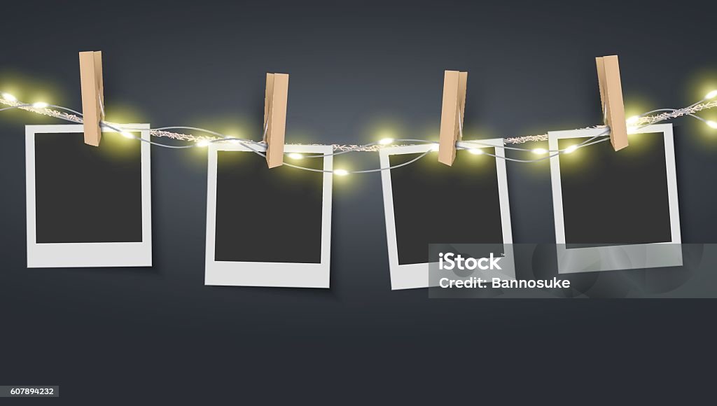 Blank photo frame hanging on rope with fairy lights Vector EPS 10 format. Photograph stock vector