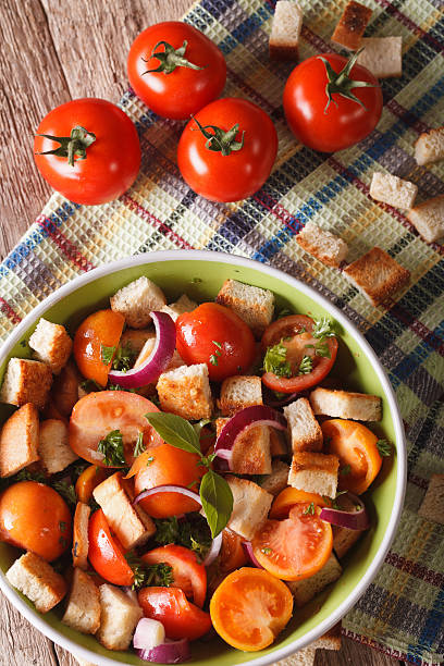 istock Traditional Italian panzanella salad closeup. vertical top view 607895190