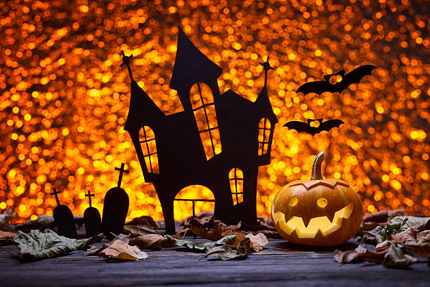 istock Castle, bat and pumpkins for Halloween 607895222