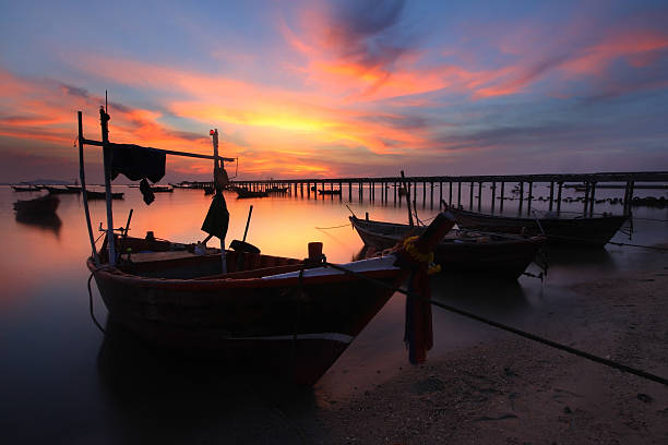 istock small fishing boats moored beached 607896334