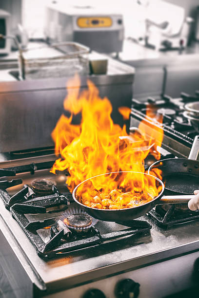 istock Chef is making flambe sauce 607897306