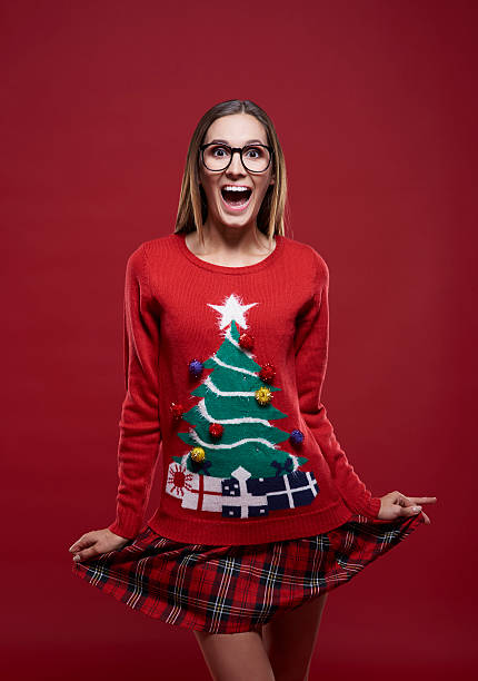 Funny girl in christmas time Funny girl in christmas time christmas nerd sweater cardigan stock pictures, royalty-free photos & images