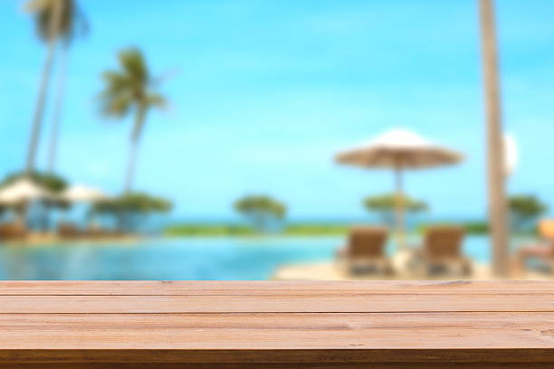 istock Wooden shelf and sea side resort on background. 607898398