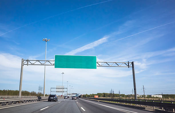 istock Green information banner over traffic lanes 607901234