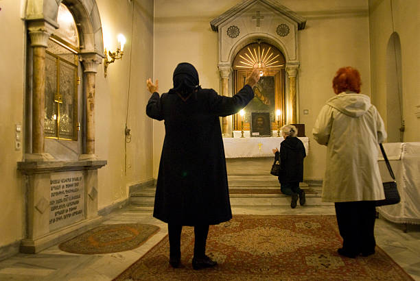 Women who praying in an Armenian Church. Istanbul, Turkey - April 21, 2011 : Women who praying in an Armenian Church, Kurtulus, Istanbul, Turkey. jusus stock pictures, royalty-free photos & images