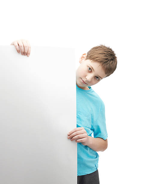 istock Serious young boy with a sheet of paper 607903348