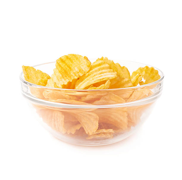 istock Multiple potato chips in a glass bowl 607904742