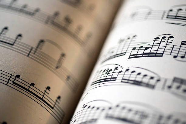 istock music sheet, sepia color tone 607906086