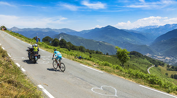 The Cyclist Andriy Grivko - Tour de France 2015 Col D'aspin, France - July 15, 2015: The Ukarainian cyclist Andriy Grivko of Astana Team, climbing the road to Col D'Aspin  in Pyrenees Mountains during the stage 11 of Le Tour de France 2015. tour de france stock pictures, royalty-free photos & images