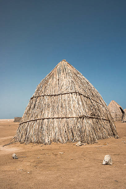 istock Huts of dried leaves 607906546