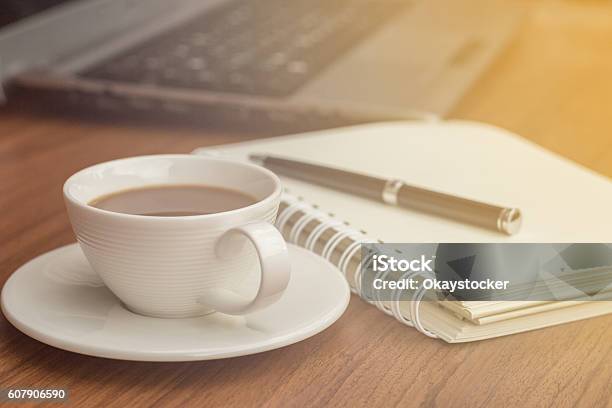 Coffee Cup And Blank Notebook On The Wooden Desk Stock Photo - Download Image Now - Abstract, Backgrounds, Book