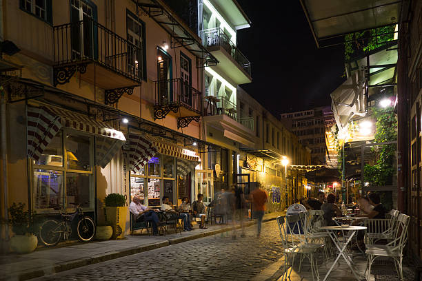 Thessaloniki, Greece - September 2, 2016: Nightlife with people in the street , sitting at cafè, dining, during summer, photo taken in Thessaloniki, Greece