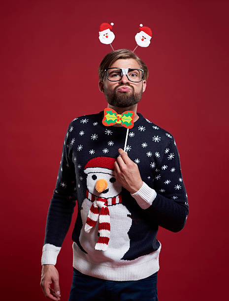 Funny man in Christmas time Funny man in Christmas time christmas nerd sweater cardigan stock pictures, royalty-free photos & images