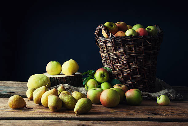 istock Wild apples and pears in basket 607909278