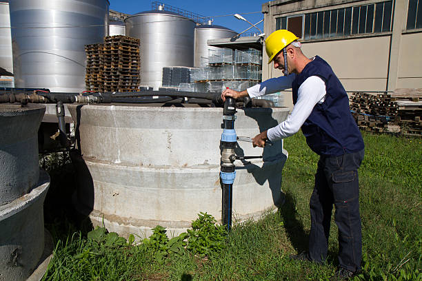 istock electrician and general worker fitting the pipes 607909440