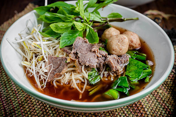 asian noodle soup with beef meatball with fresh vegetable