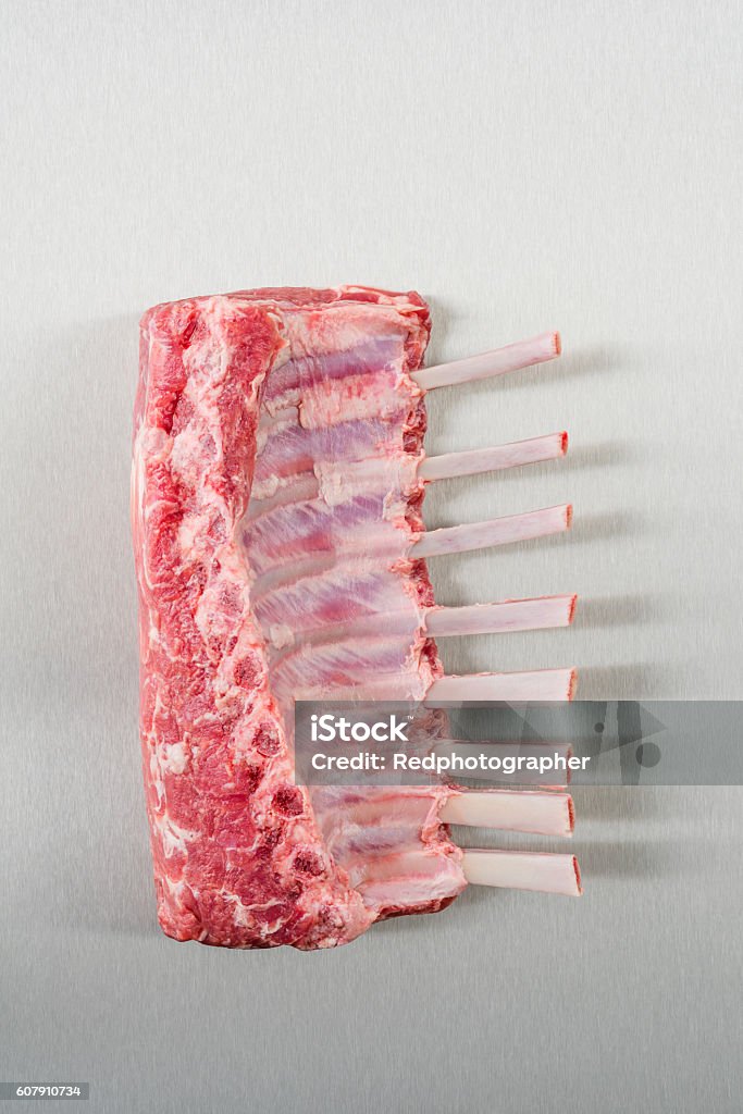 Rack of lamb Raw rack of lamb on stainless steel Directly Above Stock Photo