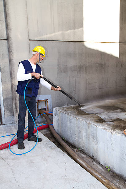 istock electrician and general worker washing  the floor 607913084