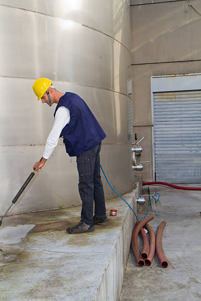 istock electrician and general worker washing  the floor 607913318