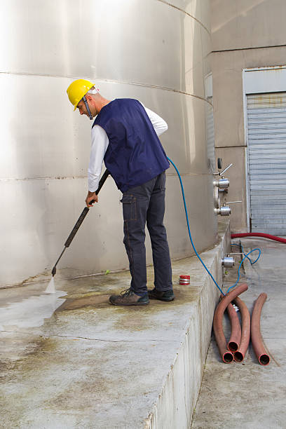 istock electrician and general worker washing  the floor 607913428