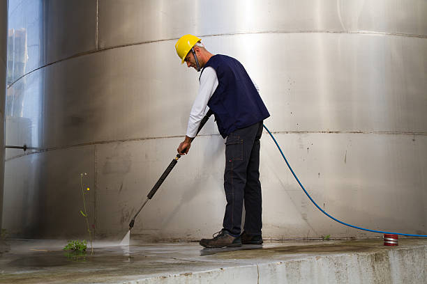 istock electrician and general worker washing  the floor 607914042