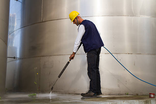 istock electrician and general worker washing  the floor 607914260