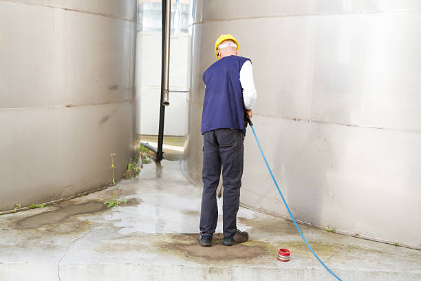 istock electrician and general worker washing  the floor 607914418