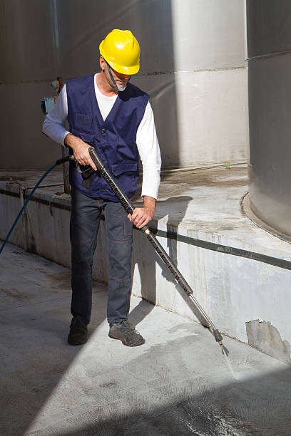 istock electrician and general worker washing  the floor 607915832