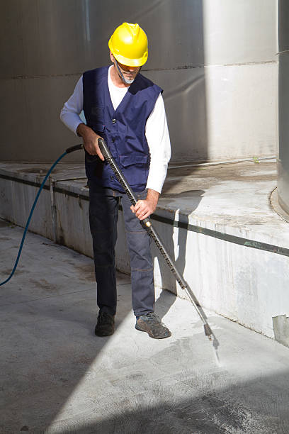 istock electrician and general worker washing  the floor 607915904