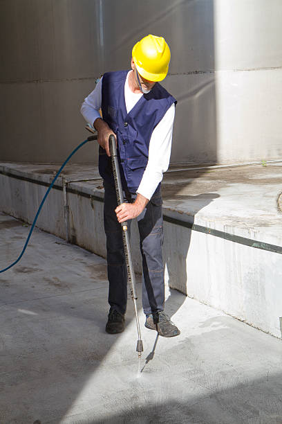 istock electrician and general worker washing  the floor 607916004