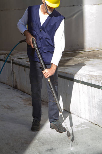 istock electrician and general worker washing  the floor 607916092