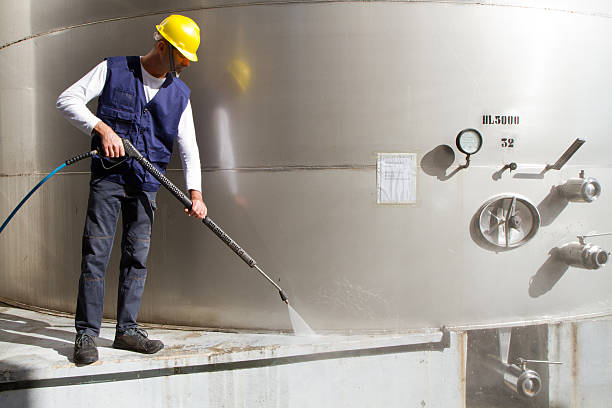 istock electrician and general worker washing  the floor 607917172