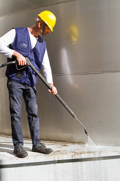 istock electrician and general worker washing  the floor 607917252