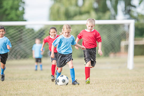 istock Kicking the Ball up the Field 607917292