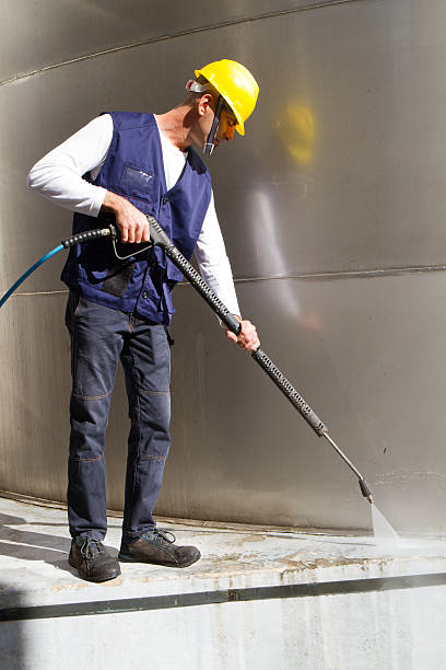 istock electrician and general worker washing  the floor 607917350