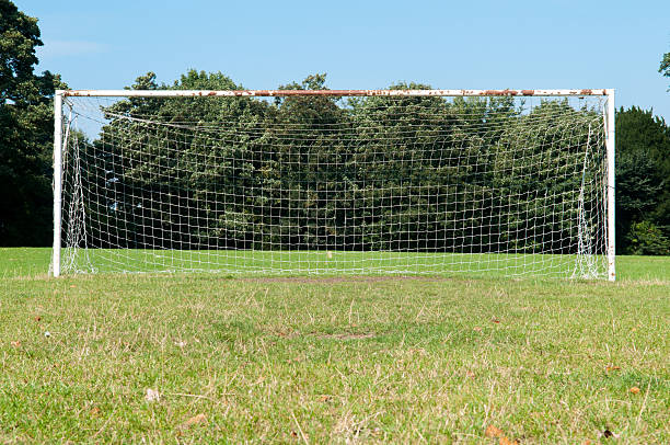 istock Football goal posts and net on a soccer pitch 607917426
