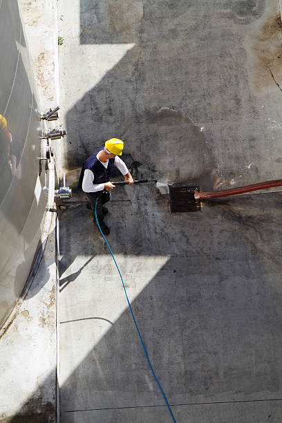 istock electrician and general worker washing  the floor 607917920