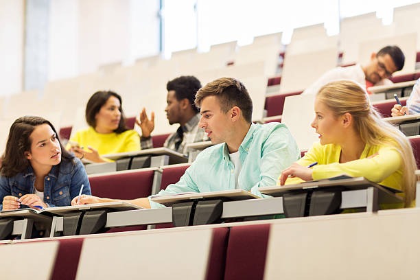 istock group of students with notebooks in lecture hall 607918986