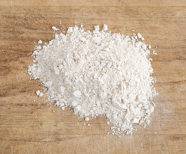 istock Quinoa flour on a wood cutting board. 607919106