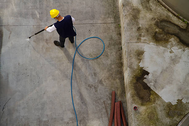 istock electrician and general worker washing  the floor 607919242