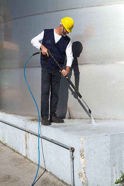 istock electrician and general worker washing  the floor 607920372