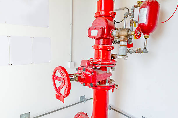 istock Industrial safety fire control system, red water pipes with valv 607923028