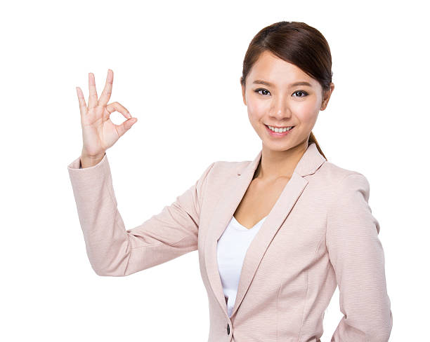 istock Businesswoman making ok sign 607926114