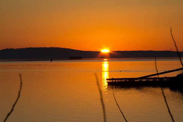 istock Golden glow over the water 607927328