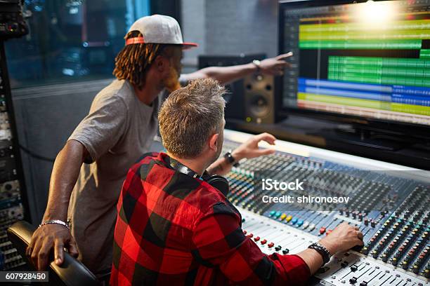 Mixing Sounds Stock Photo - Download Image Now - Producer, Music, Adult