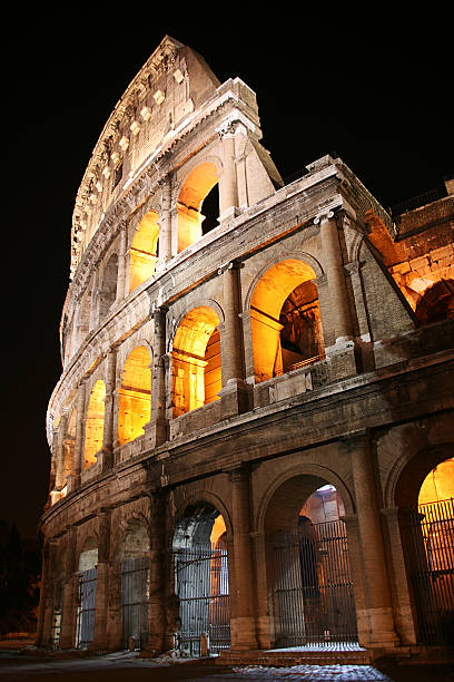 istock Ancient Colosseum at night, Rome, Italy 607928820