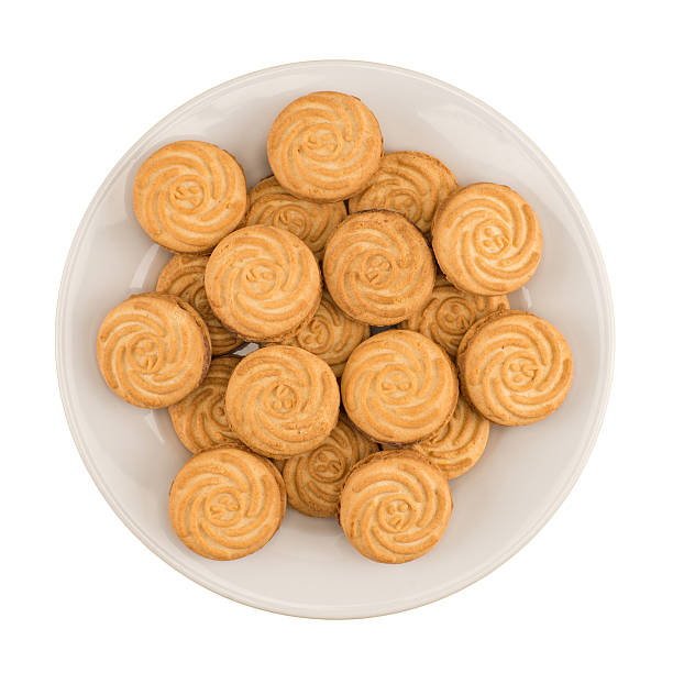 istock Tasty cookies in white plate on a white background 607929552