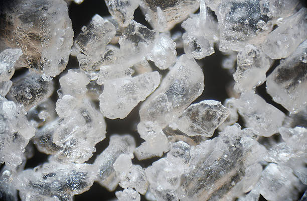 Sea salt grain on a dark background