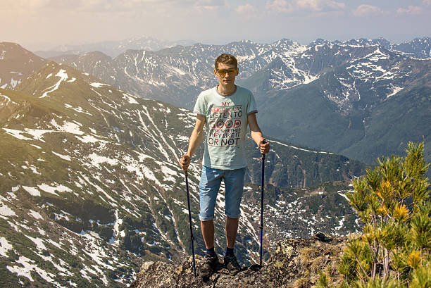 istock man walks in the mountains 607930028