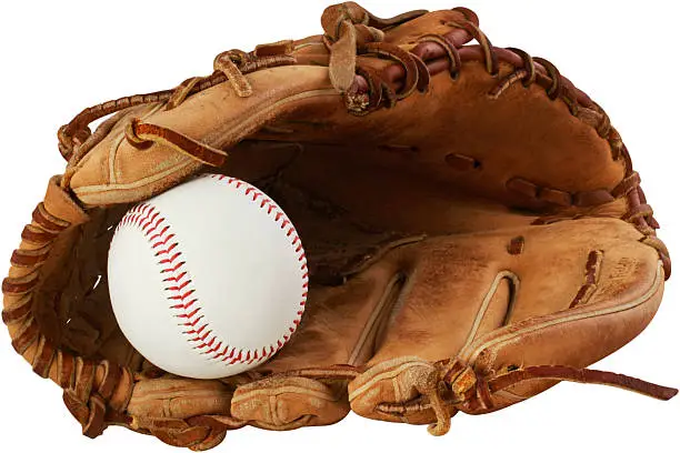 Photo of baseball glove and ball on a white background